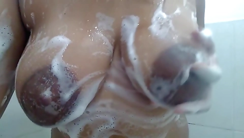 Ebony milf shows off her big tits and body in a solo