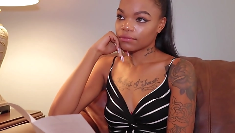 Ebony brunette with a tattooed pussy gets on the toy