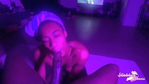 Ebony brunette with a tattoo sucks her man's big cock