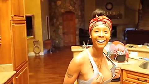 Tattooed girl with big boobs is stripping for a solo