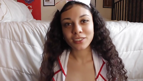 Black nurse masturbating with a dildo in bed on webcam