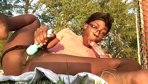 Ebony beauty enjoys smoking on outdoor in solo clip