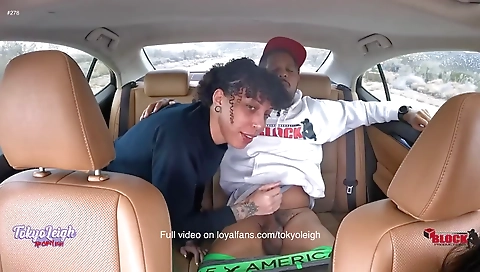 My black babe is in a car and she is getting a blowjob