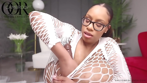 Sexy brunette fucks herself in bed in a solo video