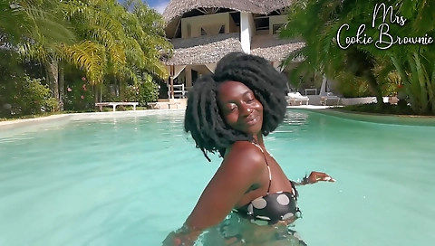 Stunning brunette with a sexy ass enjoys the poolside