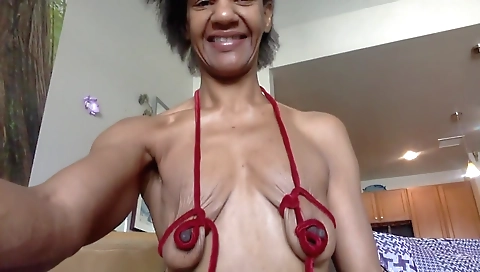 Busty ebony brunette amateur is getting naked in a hot solo video
